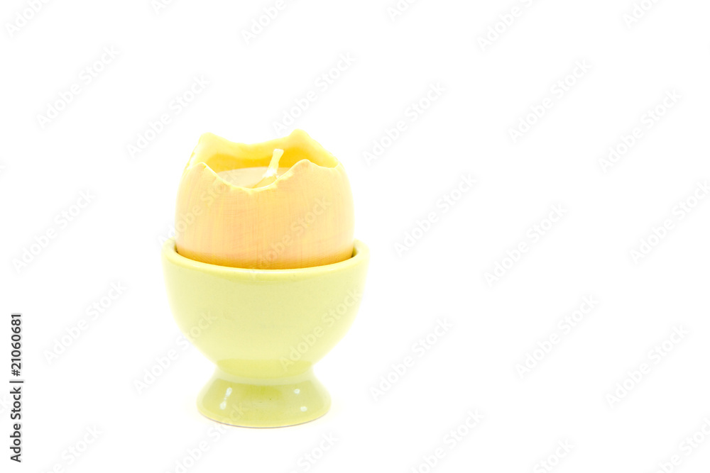egg candle in eggcup isolated on white egg candle in eggcup isolated on white