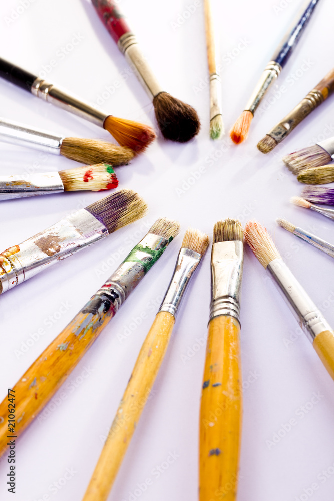 Fototapeta premium Used paint brushes of different colors