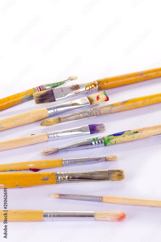Used paint brushes of different colors Used paint brushes of different colors
