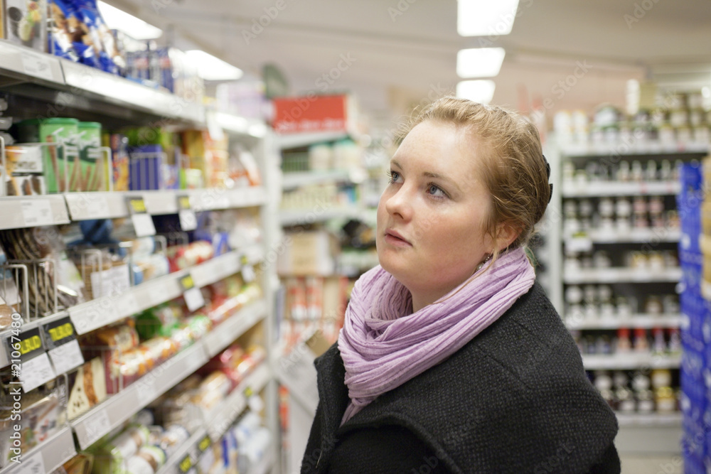 Shopping - Pretty young woman in supermarket