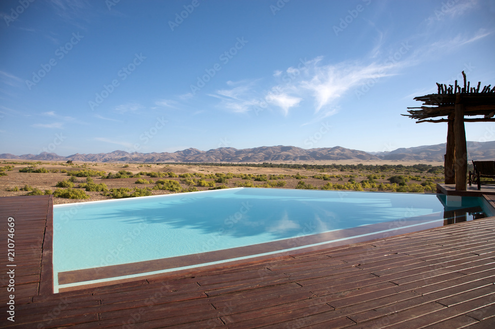 Luxury pool in a hotel and the desert of Namibia
