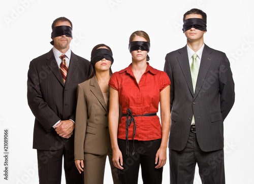 Business people in blindfolds