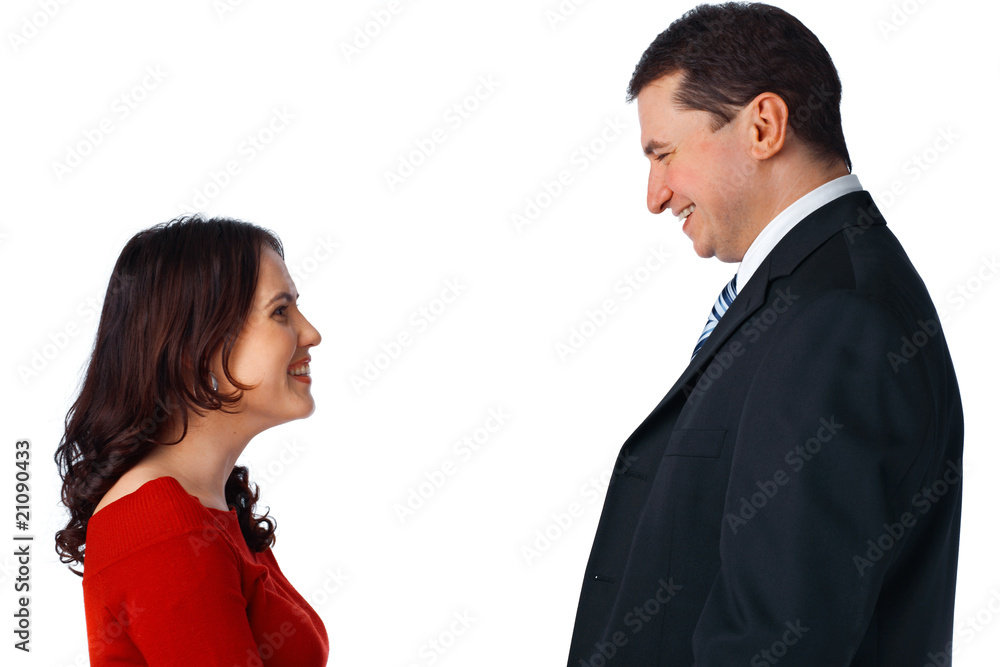 Young couple standing opposite and looking at each other Young couple standing opposite and looking at each other