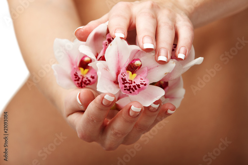 Beautiful orchid over woman body