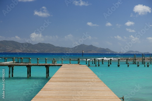 Jetty on tropical paradise Anguilla with view to St. Martin photo
