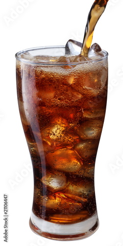 Pouring of cola in the glass with ice