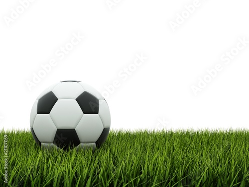 Black and white football on grass