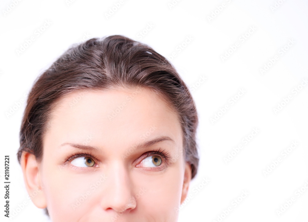 Smiling young woman looking up into the coner.