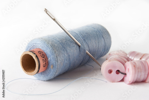 Billede på lærred Coils of colour threads with buttons