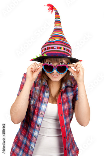 Beautiful girl smiles in sunglasseses and colour hat photo