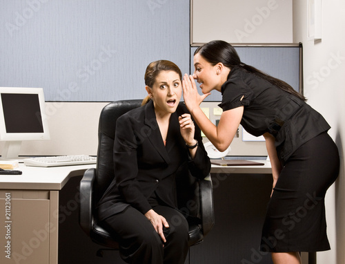 Co-workers gossiping