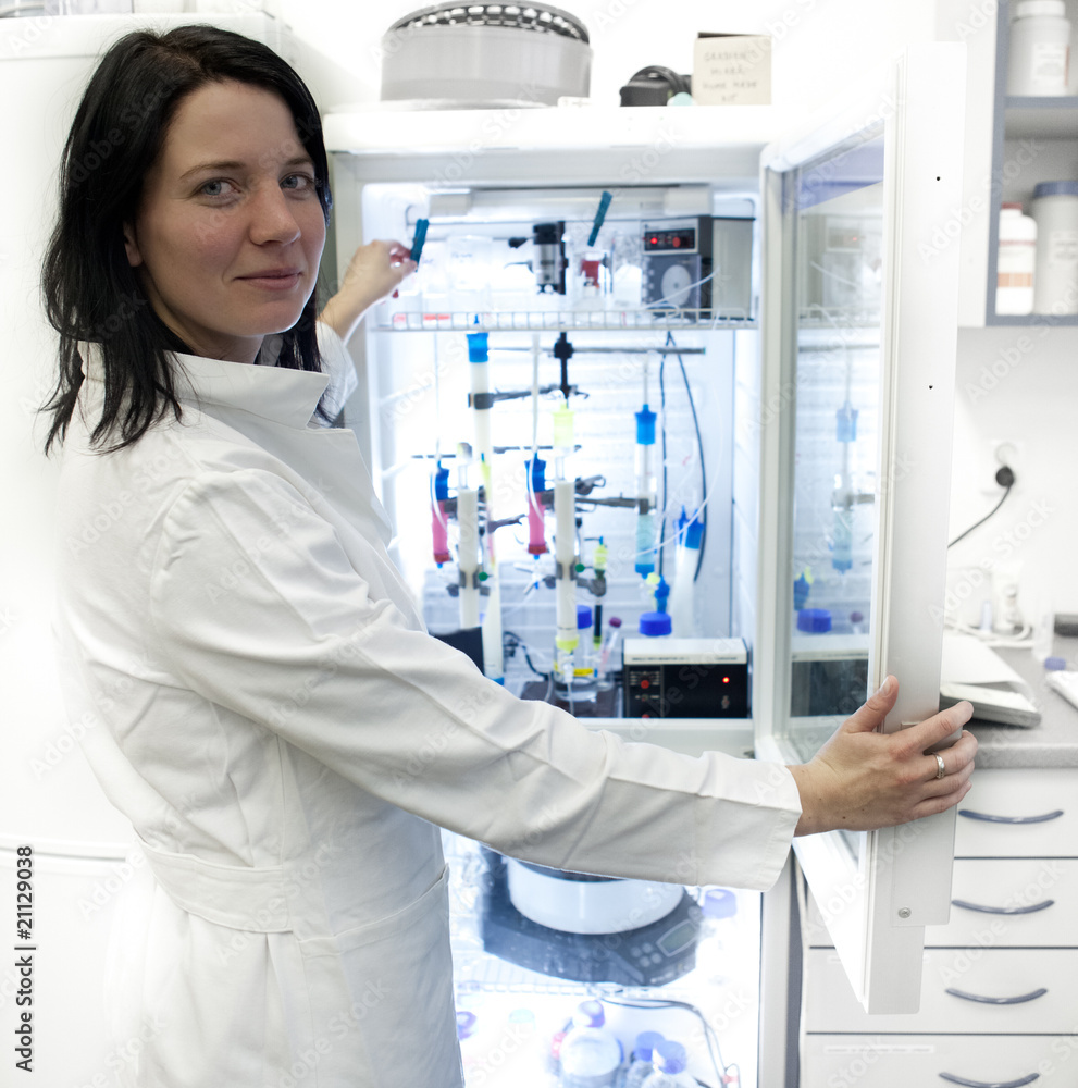Portrait of a female researcher carrying out research experiment
