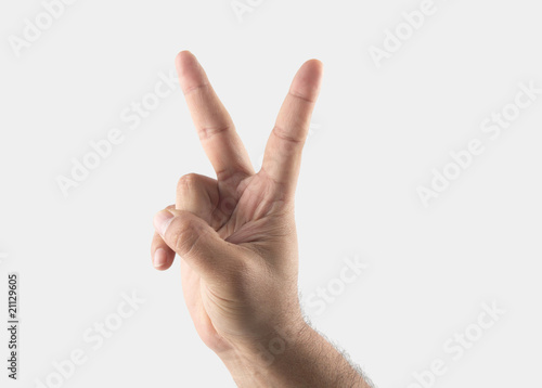 male hand with two fingers up in the peace or victory symbol