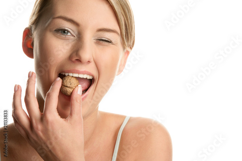 Woman with walnut winking