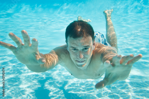 Man swimming under water