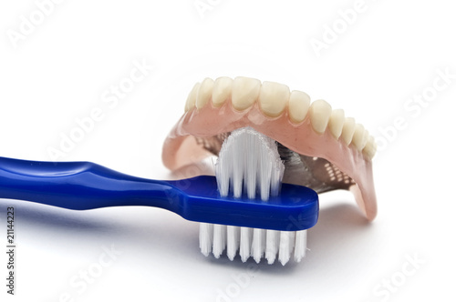 Dentures with brush