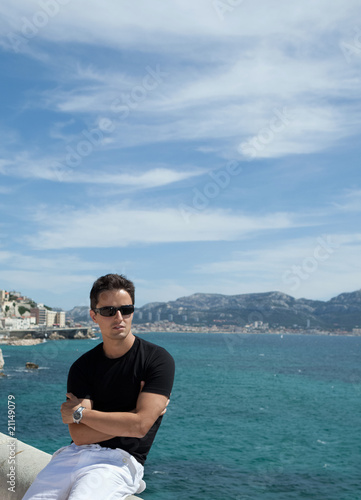 handsome young man by the sea/ocean