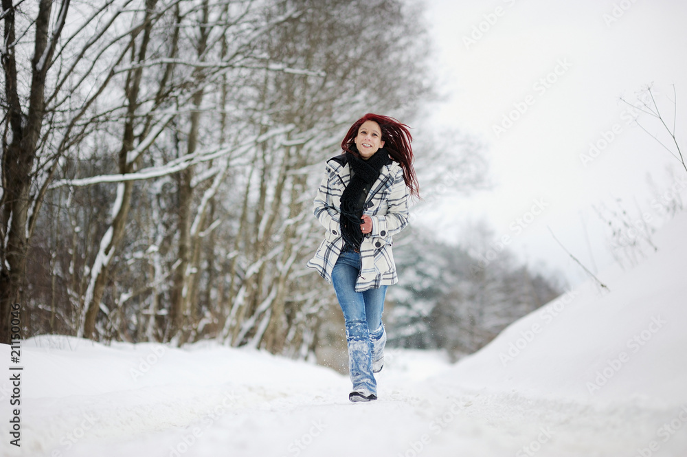 Young woman in snowy forest