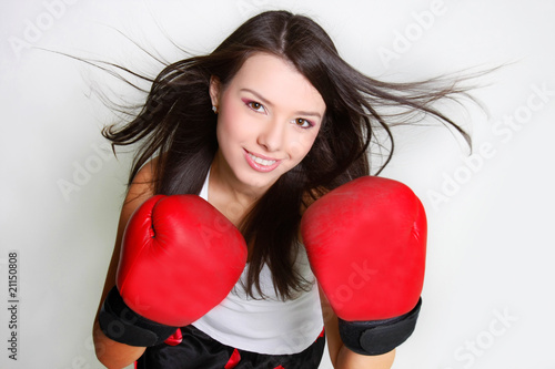 studio shot of smiiling female boxer photo