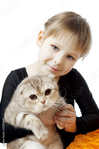 Little girl with a cat on a white background