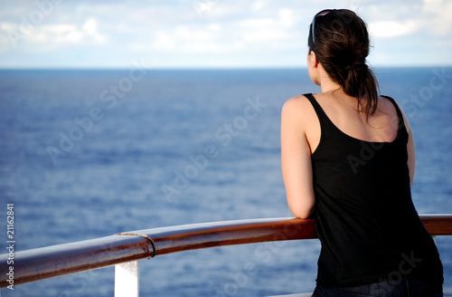 Woman looking out at sea (rear view)