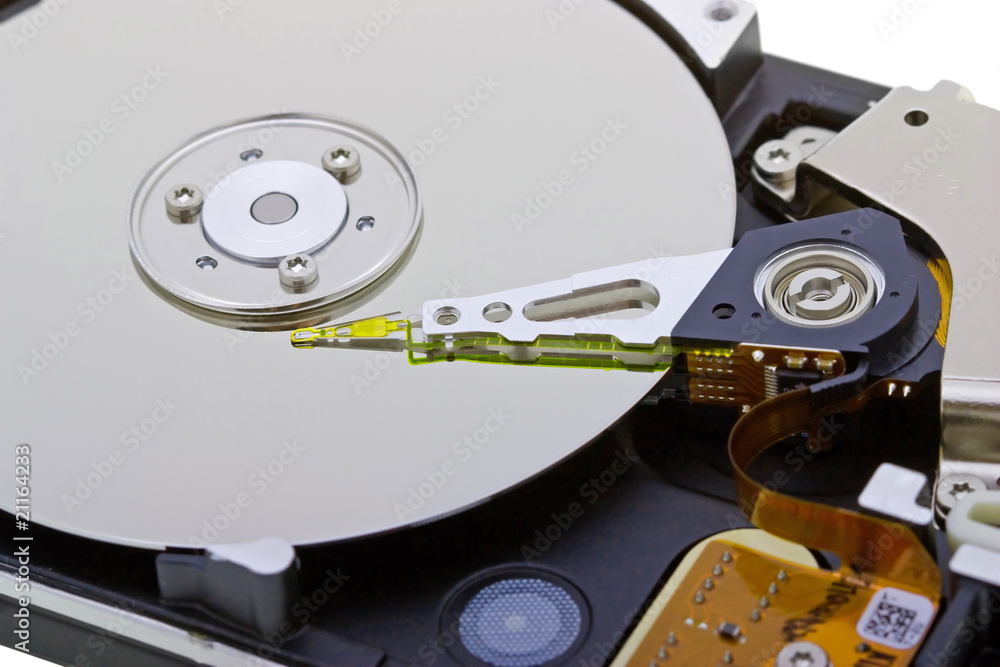 Close-up inside view of hard disk isolated on white Close-up inside view of hard disk isolated on white