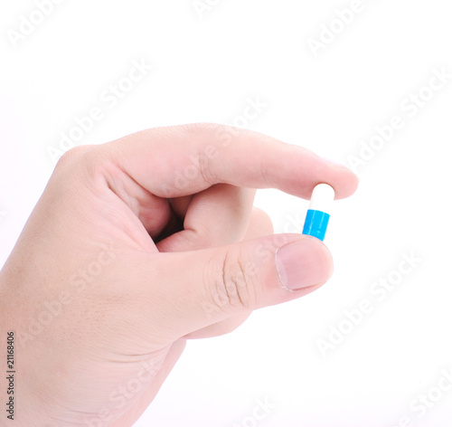 Medicine in a hand on white background
