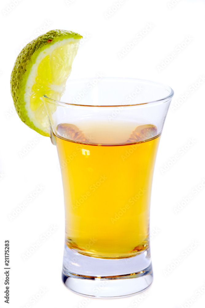 Glass of Tequila shot with lime isolated on white Glass of Tequila shot with lime isolated on white