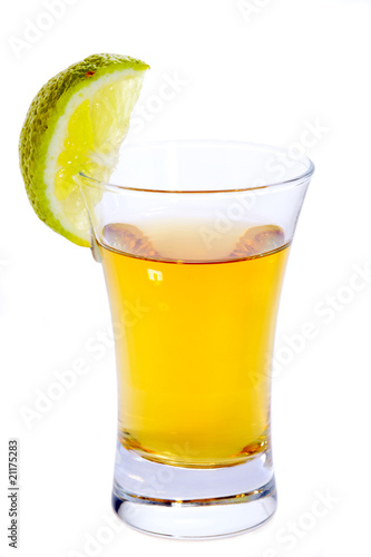 Glass of Tequila shot with lime isolated on white