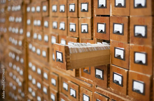 Fotografering Old wooden card catalogue with one opened drawer
