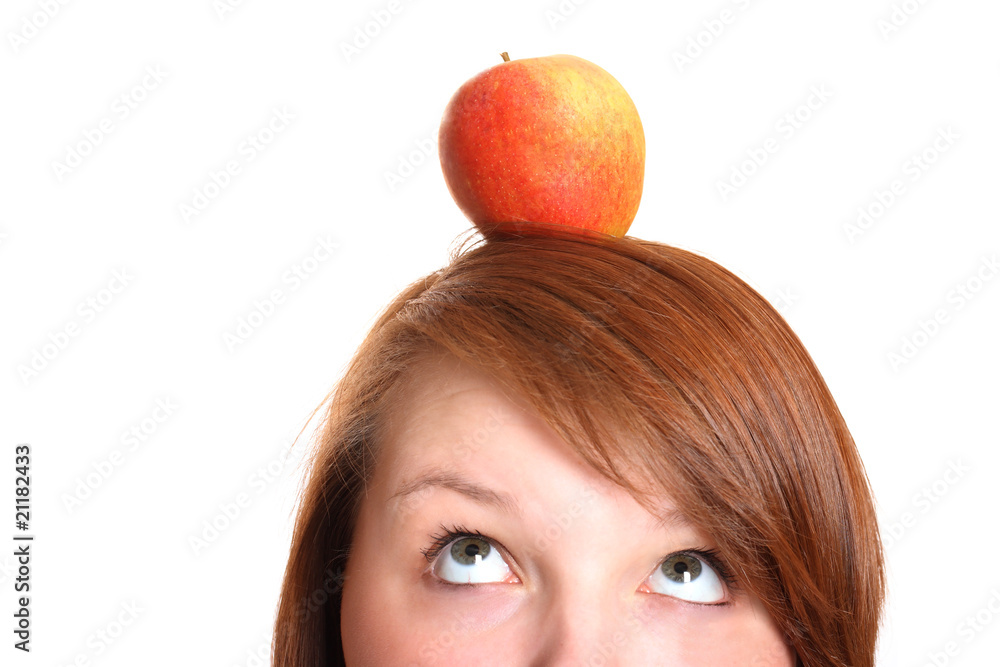 Pretty teenager balancing an apple on her head Pretty teenager balancing an apple on her head
