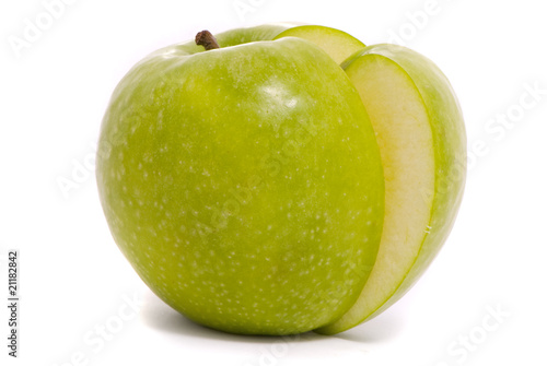 Sliced green ripe apple isolated on white background