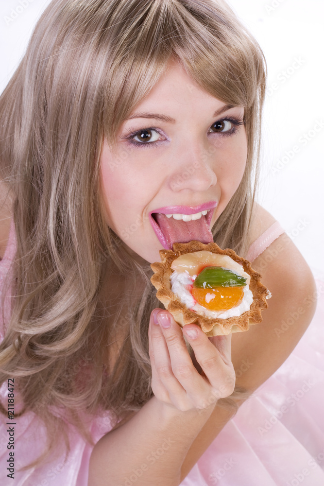 Portrait of pretty girl with piece of cake