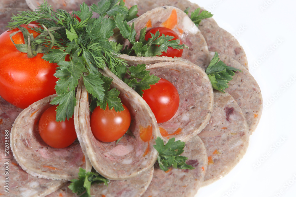Sliced food arrangement with tomato and greenery