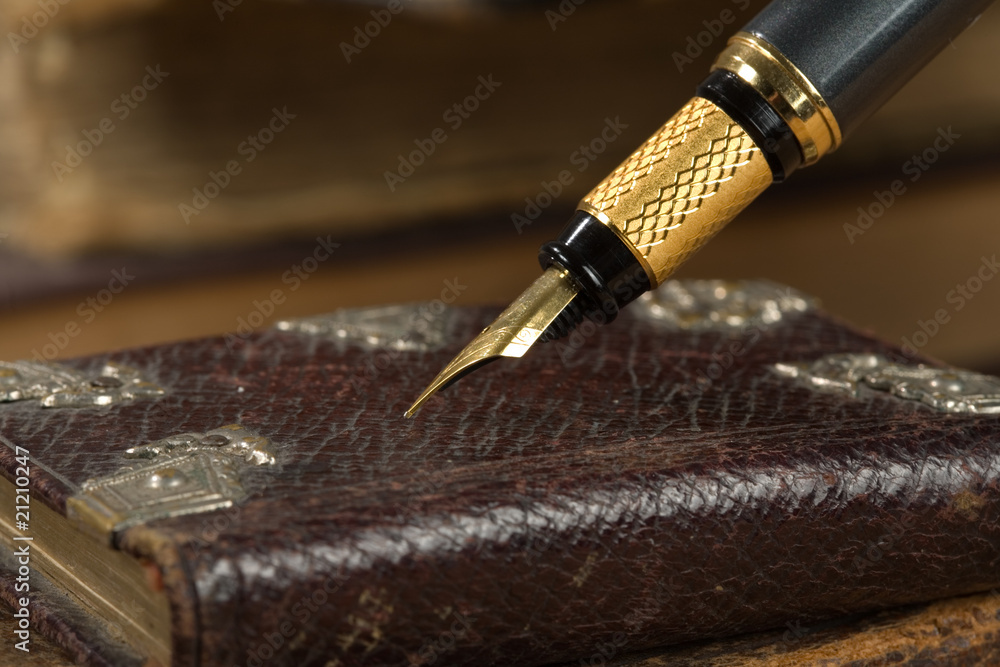 Old poetry book and a fountain pen Old poetry book and a fountain pen