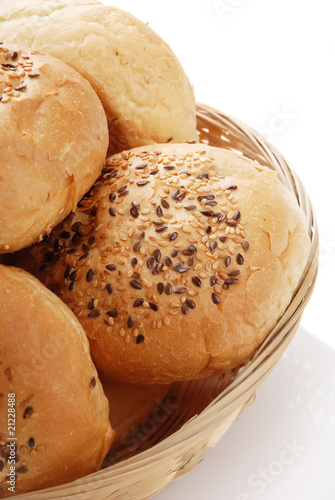 Buns with sesame in a woven basket