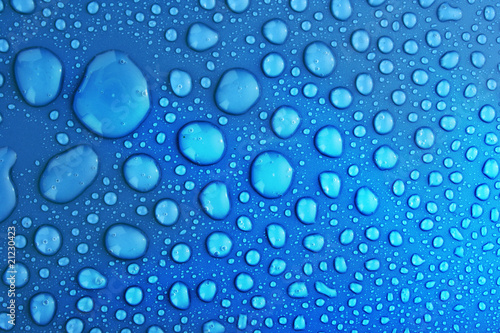 Blue water drops background with big and small drops