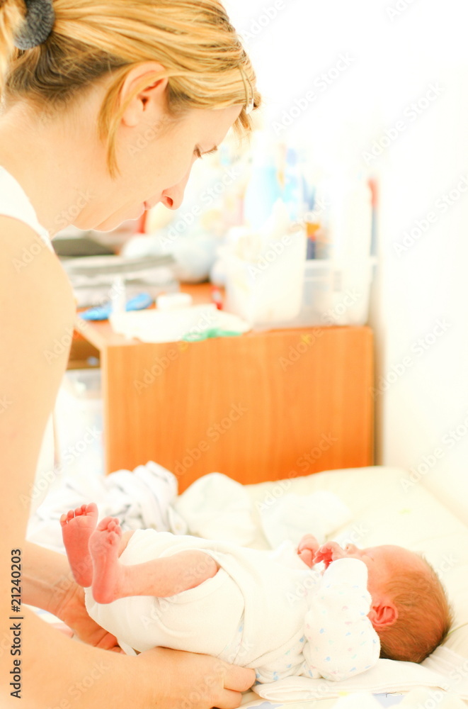 Mother taking care of newborn baby Mother taking care of newborn baby