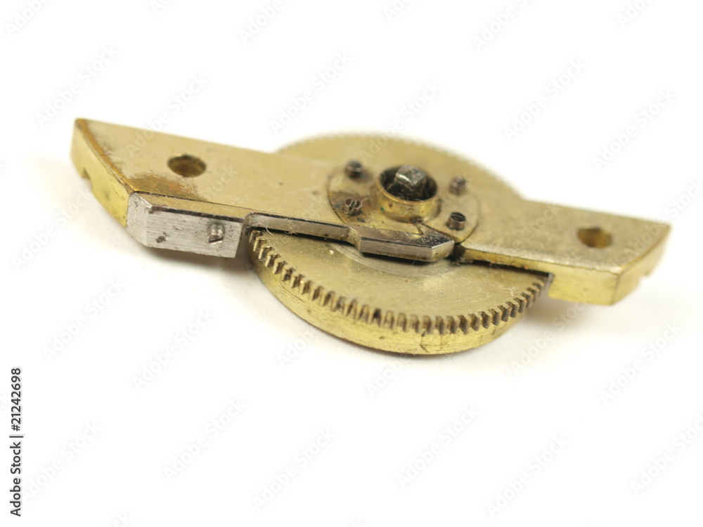 Old clock gear mechanism on white background Old clock gear mechanism on white background