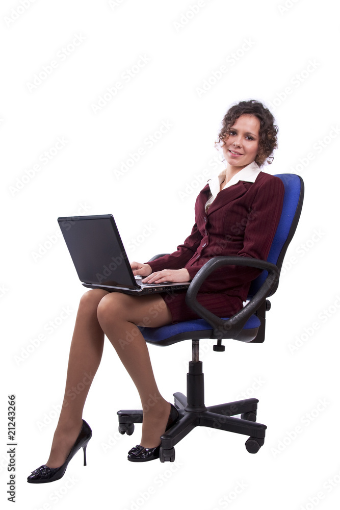 Business woman on office chair using laptop Business woman on office chair using laptop