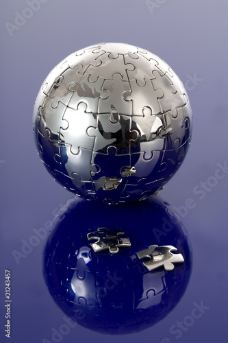Globe puzzle on blue background