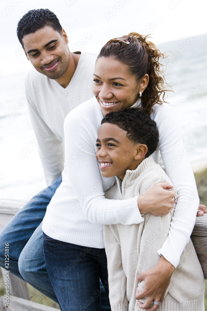 Ten year old African-American boy with parents at beach Ten year old African-American boy with parents at beach