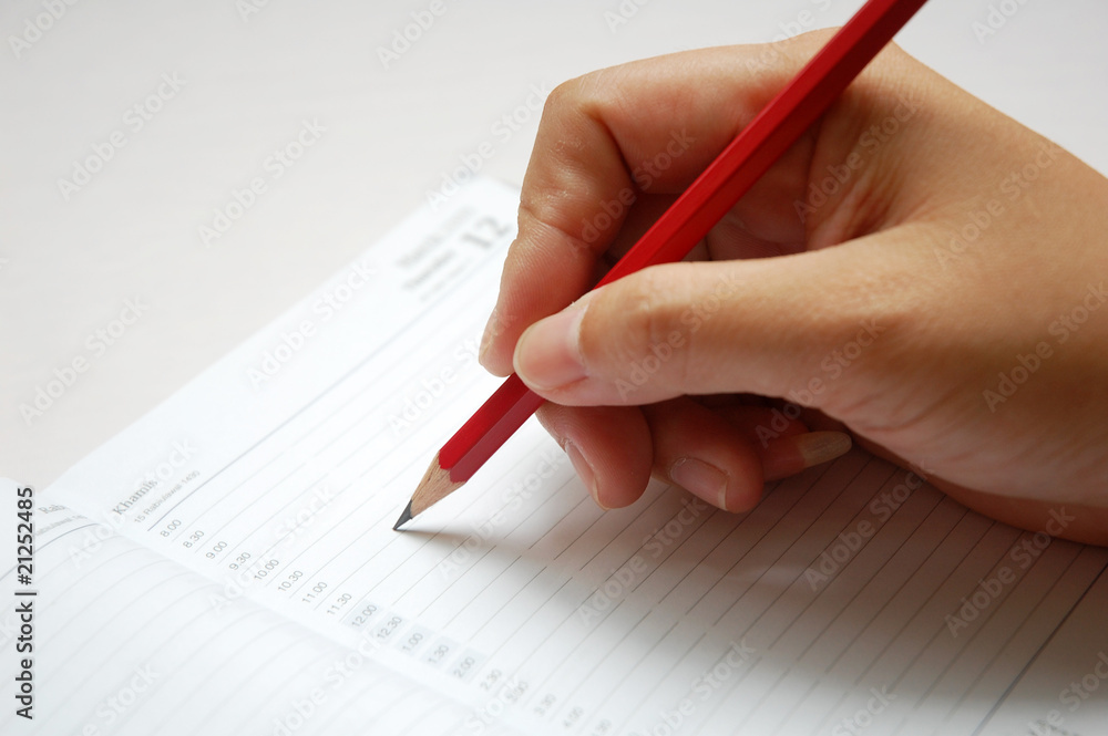 close up of writing with a pencil with white background close up of writing with a pencil with white background