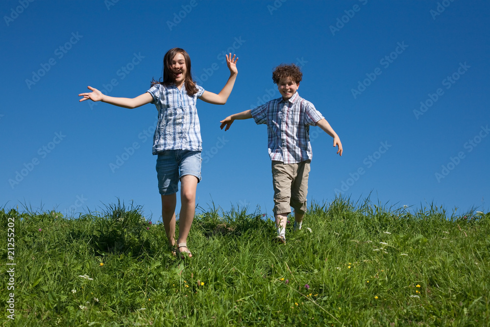 Girl and boy jumping, running outdoor Girl and boy jumping, running outdoor