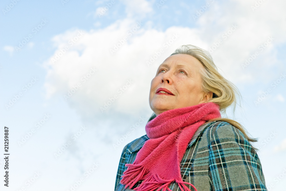 Beautiful older lady in her sixties contemplating her life Beautiful older lady in her sixties contemplating her life