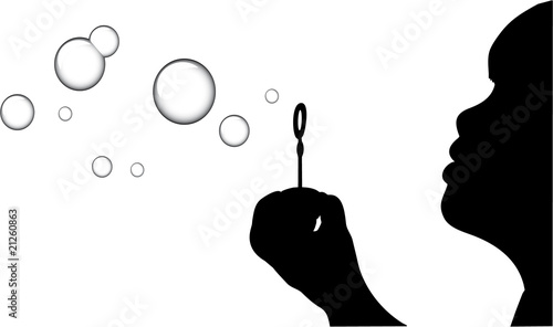 A Silhouette of a young girl blowing bubbles