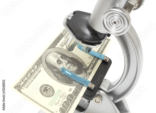 Microscope examining dollar strength