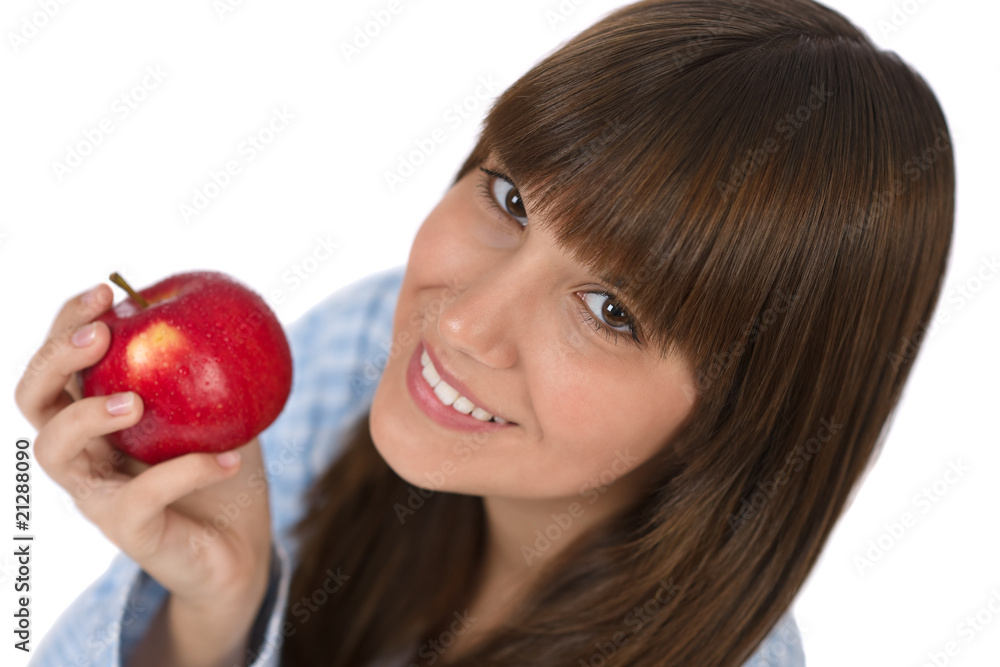 Happy teenager eating healthy apple for breakfast Happy teenager eating healthy apple for breakfast