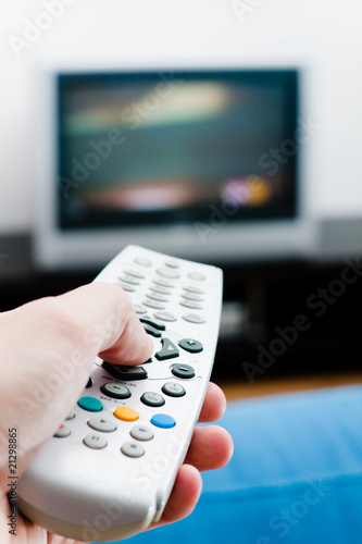 Hand with remote TV control