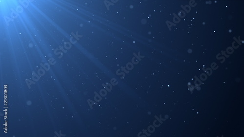 Blue background with sunbeams and particles